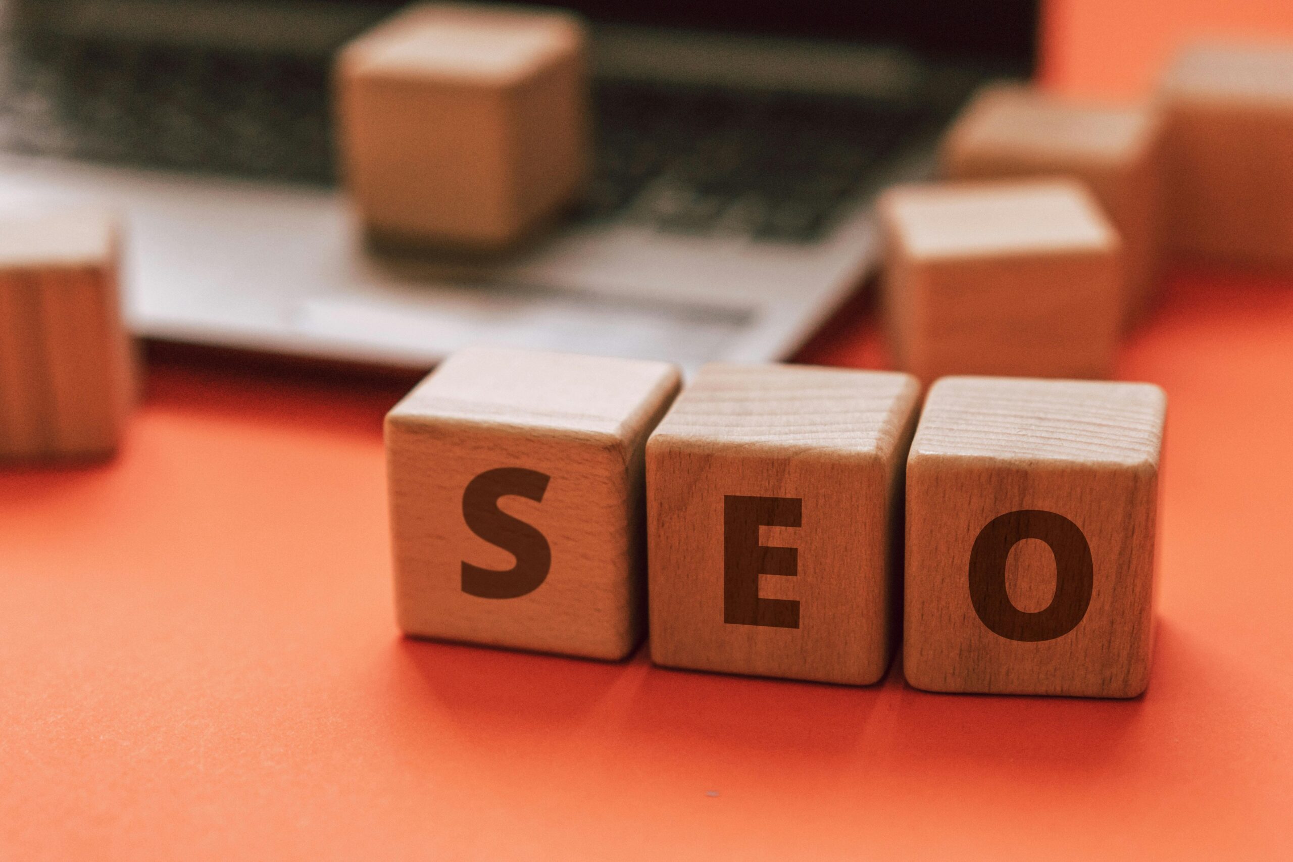 IN A TABLE THERE IS A SEO DESIGN DICE,EXECELLENT DIGITAL MARKETER IN WAYANAD ,SEARCH ENGINE OPTIMIZATION