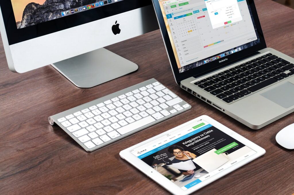 in a wooden table placed laptop,tablet