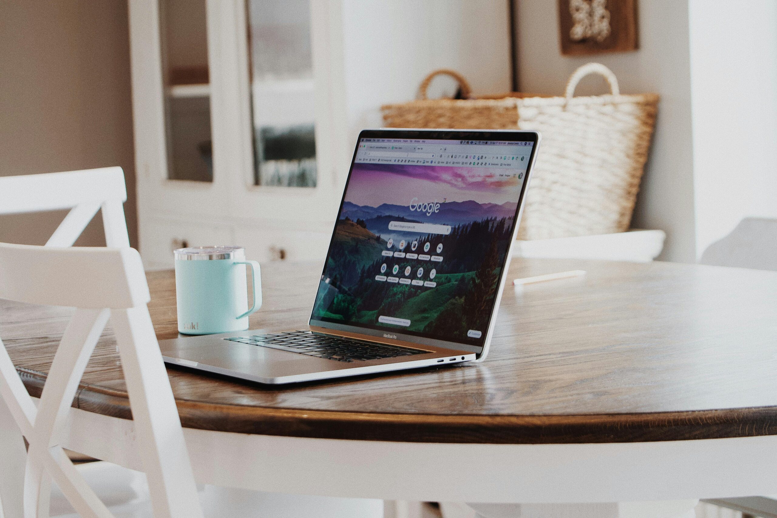 In the table there is a laptop and cup,off page seo